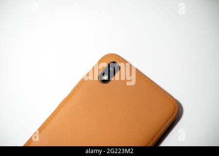 Closeup of Camera module on smartphone brown.Mobile Phone Camera, flash lens. closeup.White background. Stock Photo
