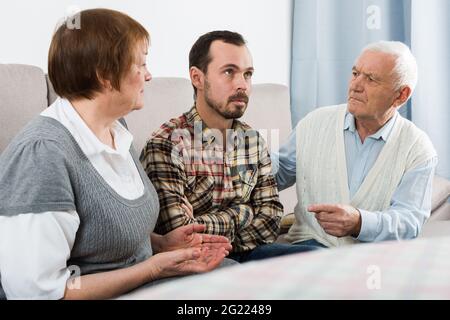 Parents arguing with son Stock Photo