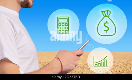Cropped of man agribusinessman using smart farming app on smartphone Stock Photo