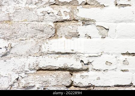 Old decayed white stone brick wall background Stock Photo