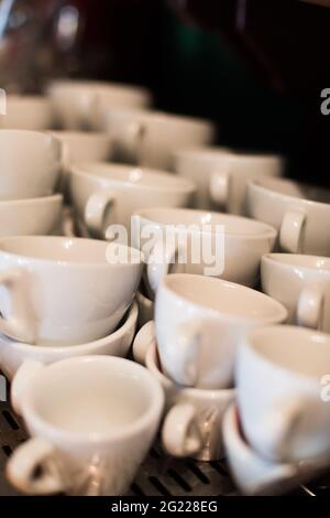 Close up shot of a stack of empty white coffee cups. Stock Photo