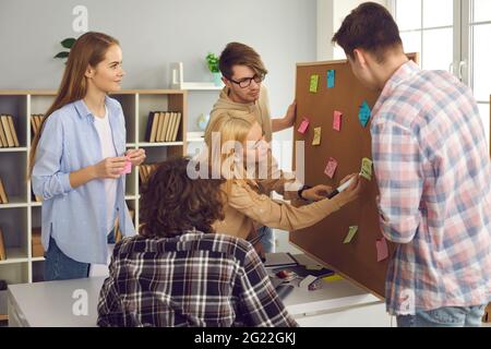 Diverse highschool or college student group discussing project in class Stock Photo