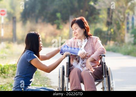 Young asian is taking care the senior woman ,Thailand Stock Photo