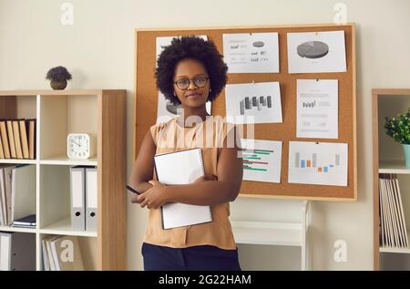 Confident young african american woman executive manager in office portrait Stock Photo