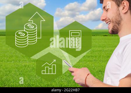 Closeup of man farmer using smart farming app on smartphone Stock Photo