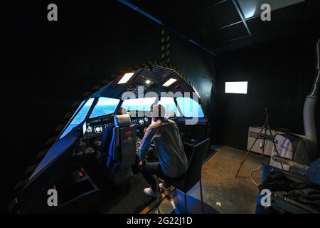 Villeurbanne (central eastern France): Airbus flight simulator in the premises of AviaSim. Pilot using the controllers in the cockpit Stock Photo