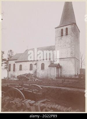 Church in Kessenich, Belgium, with a cart and vowels in the foreground. Stock Photo