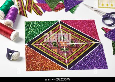 Small quilt, cutting mat and sewing and quilting accessories Stock Photo -  Alamy