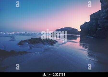 Seascape in the morning. Rocky sea coast at sunrise. Beach Playa de Las Catedrales in Ribadeo, Galicia, Spain, Europe Stock Photo