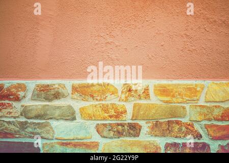 Abstract orange yellow grunge concrete and brick wall background Stock Photo