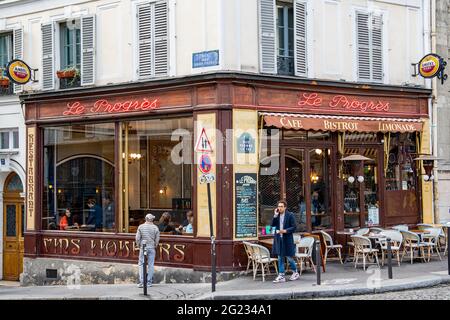 Street view of a typical outdoor coffee terrace in Montmartre district Stock Photo