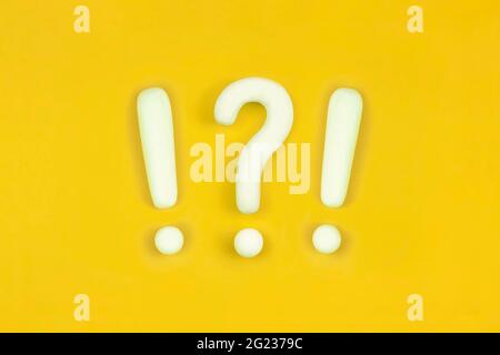 Strong emotions sign. Interrobang, question mark and exclamation mark on orange background. Communication of Wtf, unbelievable, confusion concept. Stock Photo