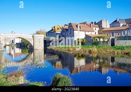 Medieval stone bridge over the river Gartempe in the middle of the town of Montmorillon, France Stock Photo