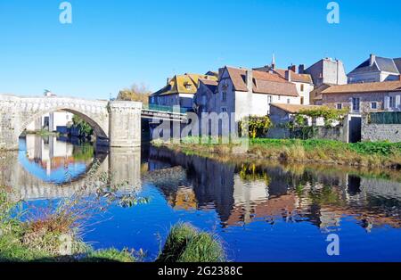 Medieval stone bridge over the river Gartempe in the middle of the town of Montmorillon, France Stock Photo