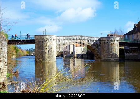 Medieval stone bridge over the river Gartempe in the middle of the town of Montmorillon, France Stock Photo