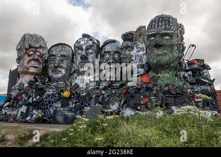 Carbis Bay, Cornwall, UK. 08th June, 2021. G7 Mount Recyclemore, 'Mount Rushmore', sculpture made of electronic waste is built on a beach in Carbis Bay Cornwall. Looking over the G7 summit, The seven faces definitely look like the world leaders who will be attending the G7 Summit this week. UK Prime Minister Boris Johnson, Japanese Prime Minister Yoshihide Suga, France's president Emmanuel Macron, Italian Prime Minister Giuseppe Conte, Canadian Prime Minister Justin Trudeau, German Chancellor Angela Merkel and US President Joe Biden. Credit: kathleen white/Alamy Live News