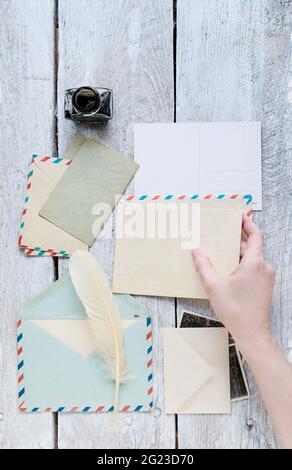 Vintage letters and postcards on wooden table. Retro style Stock Photo