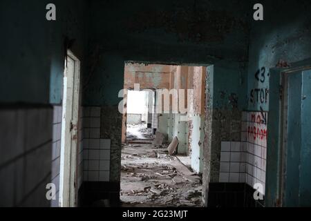 abandoned scary dark room in a large multi-storey building Stock Photo