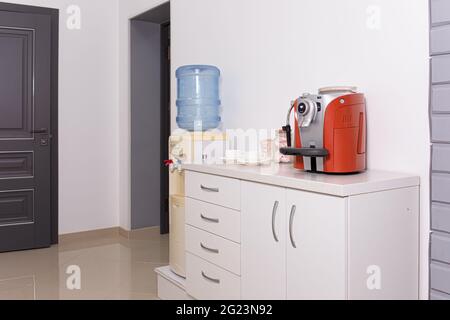 A kitchen with a sink and a mirror Stock Photo