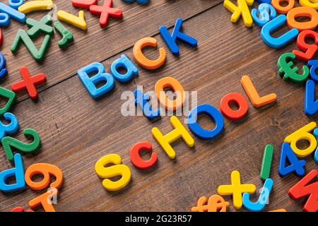 Colorful plastic word "Back To School" on wooden background Stock Photo