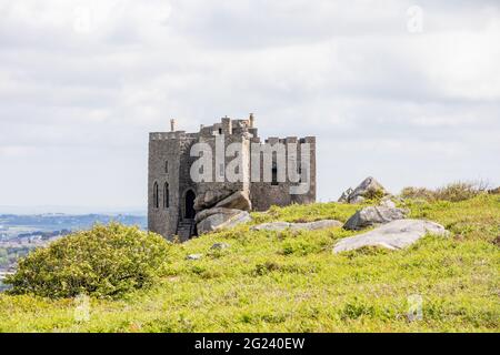 Carn Brea Castle on Carn Brea is a 14th-century grade II listed granite stone building which is now used as a restaurant Stock Photo