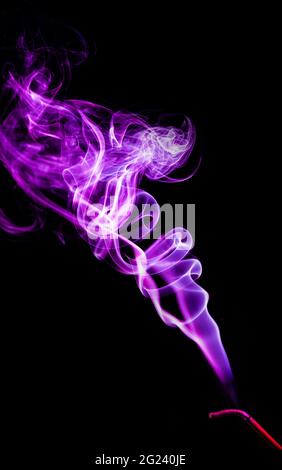 purple smoke on a black background Stock Photo