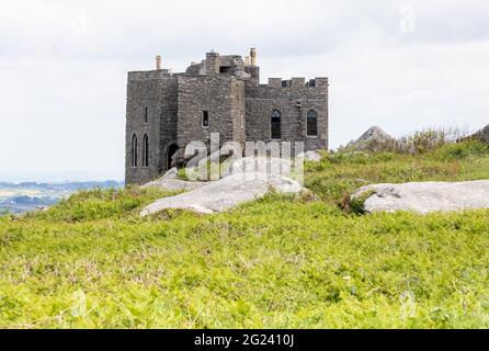 Carn Brea Castle on Carn Brea is a 14th-century grade II listed granite stone building which is now used as a restaurant Stock Photo