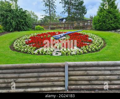 Large flower clock in a public park Stock Photo