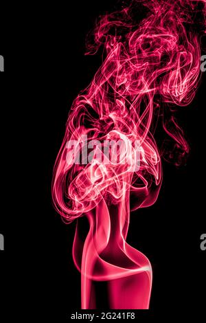 Red smoke on a black background Stock Photo