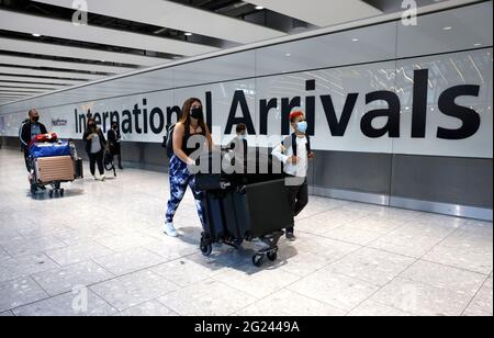 London, UK. 08th June, 2021. Passengers arriving at Heathrow as Portugal moves onto the Amber list. Many passengers were unable to catch a plane before the 4am deadline. Travel arrangements will be updated by the Government. British holidaymakers in Portugal are rushing back home before the country is added to the UK's travel amber list amid concerns about rising Covid cases. From 04:00 BST on Tuesday Portugal will be dropped from the green list, and returnees made to self-isolate for 10 days and take two PCR tests. Credit: Mark Thomas/Alamy Live News Stock Photo
