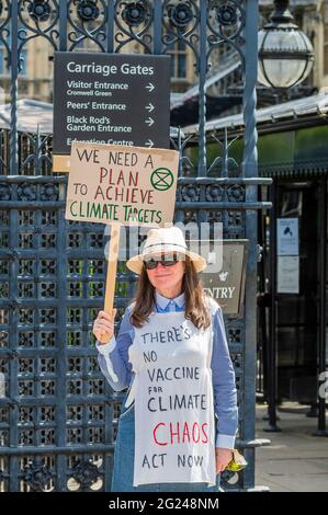 London, UK. 8th June, 2021. We need a plan - A solitary Extinction Rebellion climate protester outside Parliament. Credit: Guy Bell/Alamy Live News Stock Photo