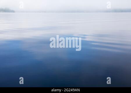 USA, New York, Adirondack Mountains, Calm lake surface Stock Photo