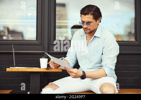 Competent businessman checking list of plans for the day Stock Photo