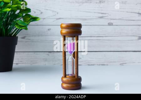 Hourglass as time passing concept for business deadline and running out of time. Space for text Stock Photo