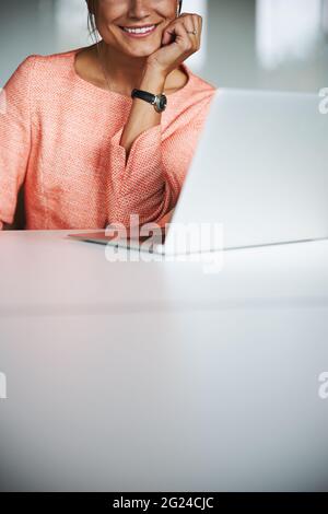 Happy smiling elegant female secretary working in the co-working place Stock Photo