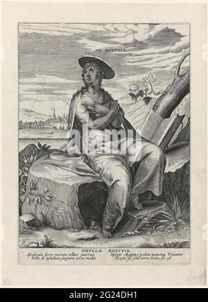 Egyptian Sibille; Sibylla aegyptia; Sibilles. The Sibille of Egypt is sitting on a rock. In addition to her is an open book. The print has a Latin caption and is one of two anonymous prints in the 17th century added to the series of Sibillen made by Philips Galle in 1575. Stock Photo