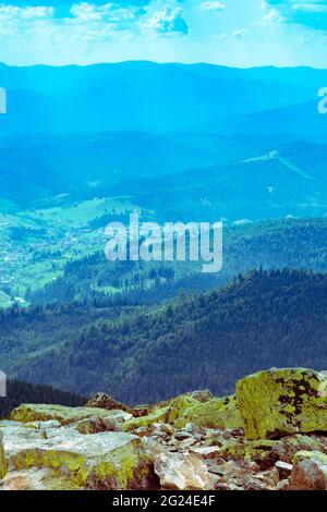 Extreme mountain hikes. Huge stones overgrown with green ome stoch