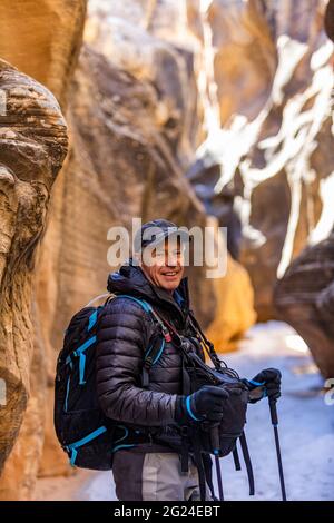 USA, Utah, Escalante, Man hiking in slot canyon in Grand Staircase-Escalante National Monument Stock Photo