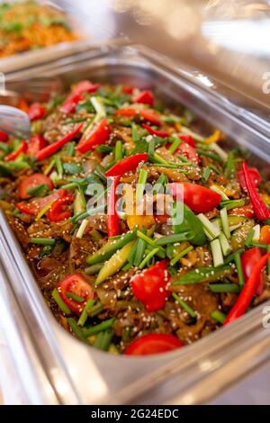 beef with tomatoes, peppers and herbs in mamrit. Stock Photo