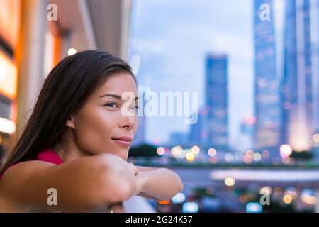 Shanghai city urban Asian woman pensive relaxing Stock Photo