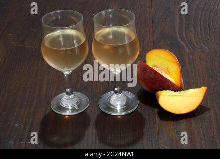 Peach in white wine Stock Photo