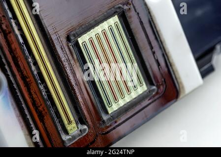 Macro shot of the printing nozzles in the inkjet printer head, seven nozzles visible. Stock Photo