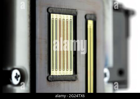 Macro shot of the printing nozzles in the inkjet printer head, seven nozzles visible. Stock Photo