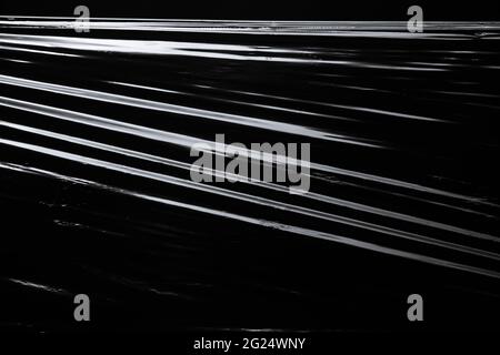 Texture of the plastic wrap on black background Stock Photo