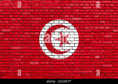flag of Tunisia painted on brick wall Stock Photo