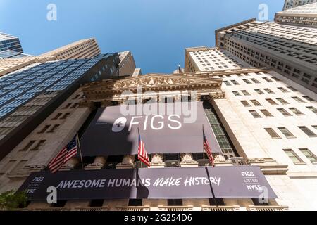 The New York Stock Exchange on Thursday, May 27, 2021 is decorated for the initial public offering for FIGS, a clothing retailer. FIGS sells scrubs, previously popular only with hospital personnel, but are now fitted and are popular with the non-medical crowd especially during the pandemic when people purchased comfortable loose clothing. (© Richard B. Levine) Stock Photo