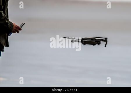Close-Up of a man flying a drone Stock Photo