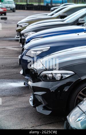 KYIV-15 MAY,2021: Lined up sport BMW M cars at Drift And Car Show. M2 F87 and M5 E60 models on parking lot Stock Photo