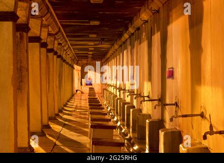 The ablutions area for ritual washing, wudu. Sultan Ahmed Mosque, also known as the Blue Mosque. An Ottoman-era Friday mosque located in Istanbul, Turkey. Illuminated at night Stock Photo