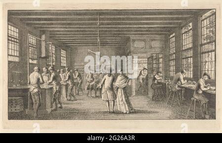 Lettergieterij van Johannes Enschedé in Haarlem. View in the Lettergortij van Johannes Enschedé in Haarlem. In the middle a man and a woman seen on the back. Left and right people are working under the windows. Stock Photo